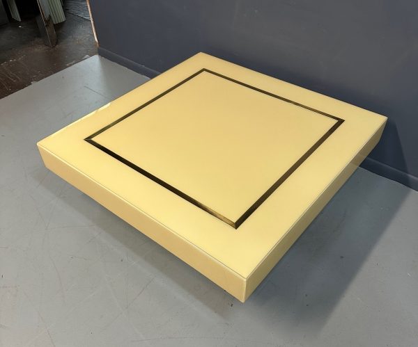 1970s Acrylic Stepped Cream Colored Coffee Table with Brass Ribbon Inlay Online now